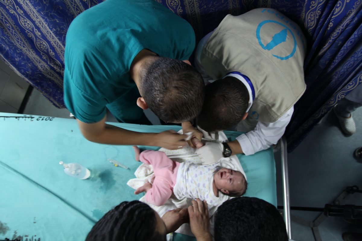 emergency aid Interpal sponsored doctors take care of a Palestinian infant