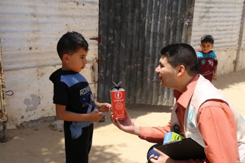 Interpal gives a tree sapling to a Palestinian child