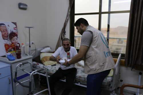 Interpal staff distribute medical aid to Palestinian patient