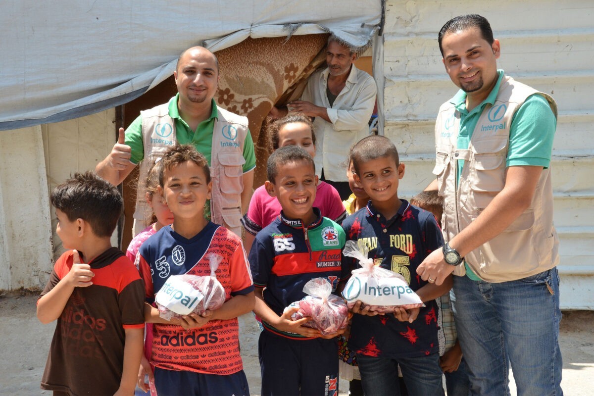 Interpal staff delivering fresh Qurbani meat to Palestinian refugee families.